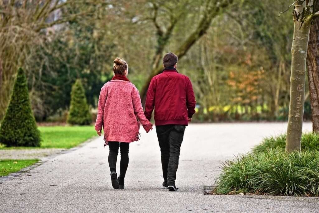 couple walking in nature limiting screen time