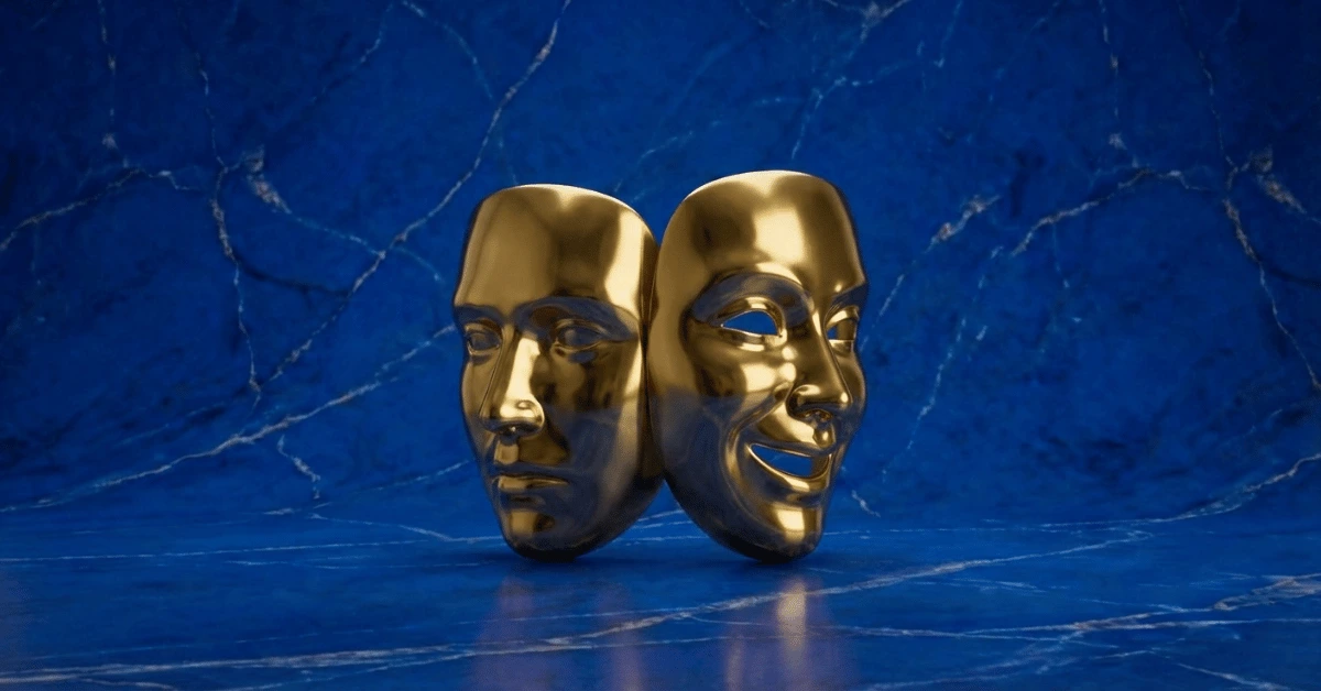 Two golden masks representing myths about introverts and extroverts.