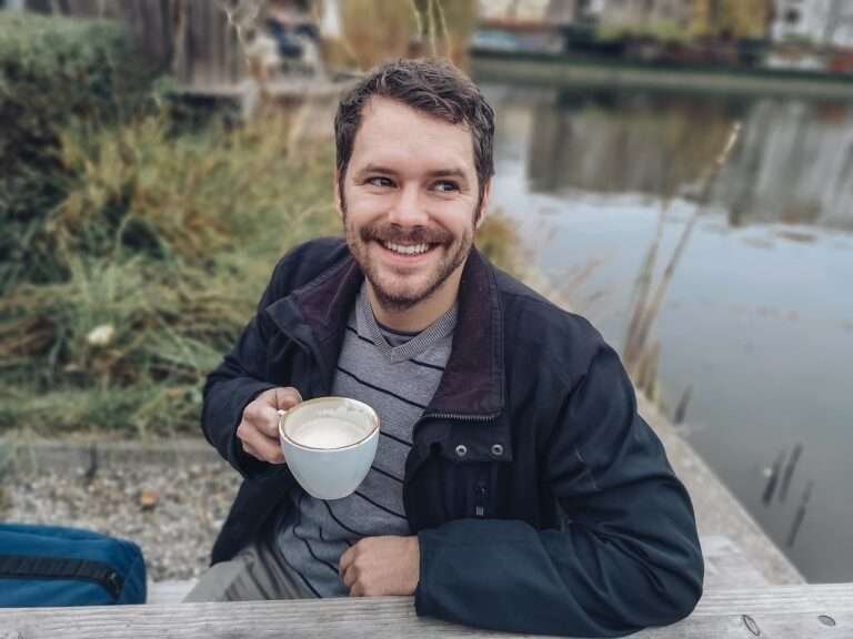 happy and confident man drinking coffee