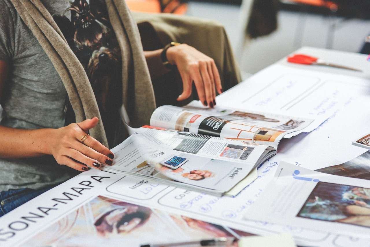 woman staying informed by reading a magazine