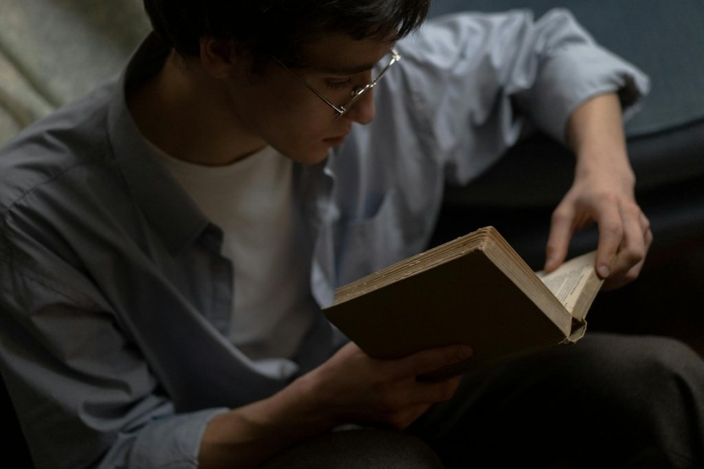 Man reading in book wondering why he can't remember what he read