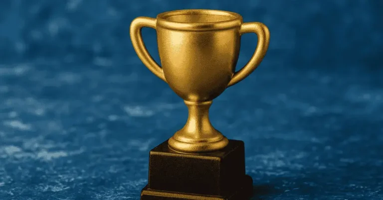 Golden trophy symbolizing small wins and building momentum through consistent progress