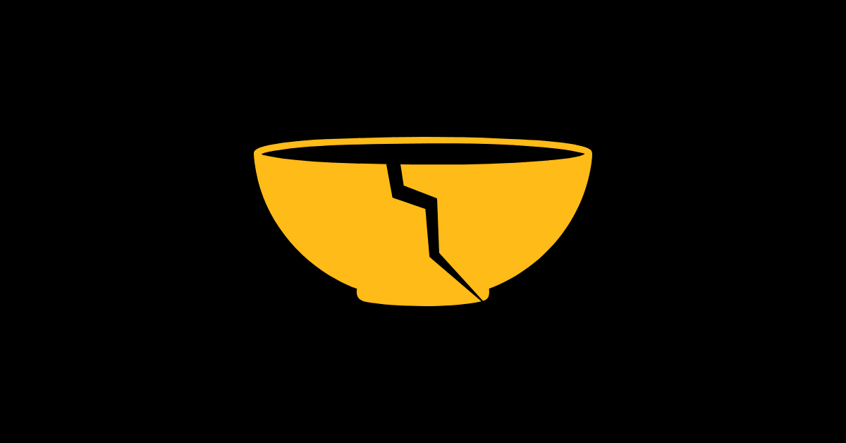 Black bowl with golden glue representing the kintsugi mindset and philosophy.